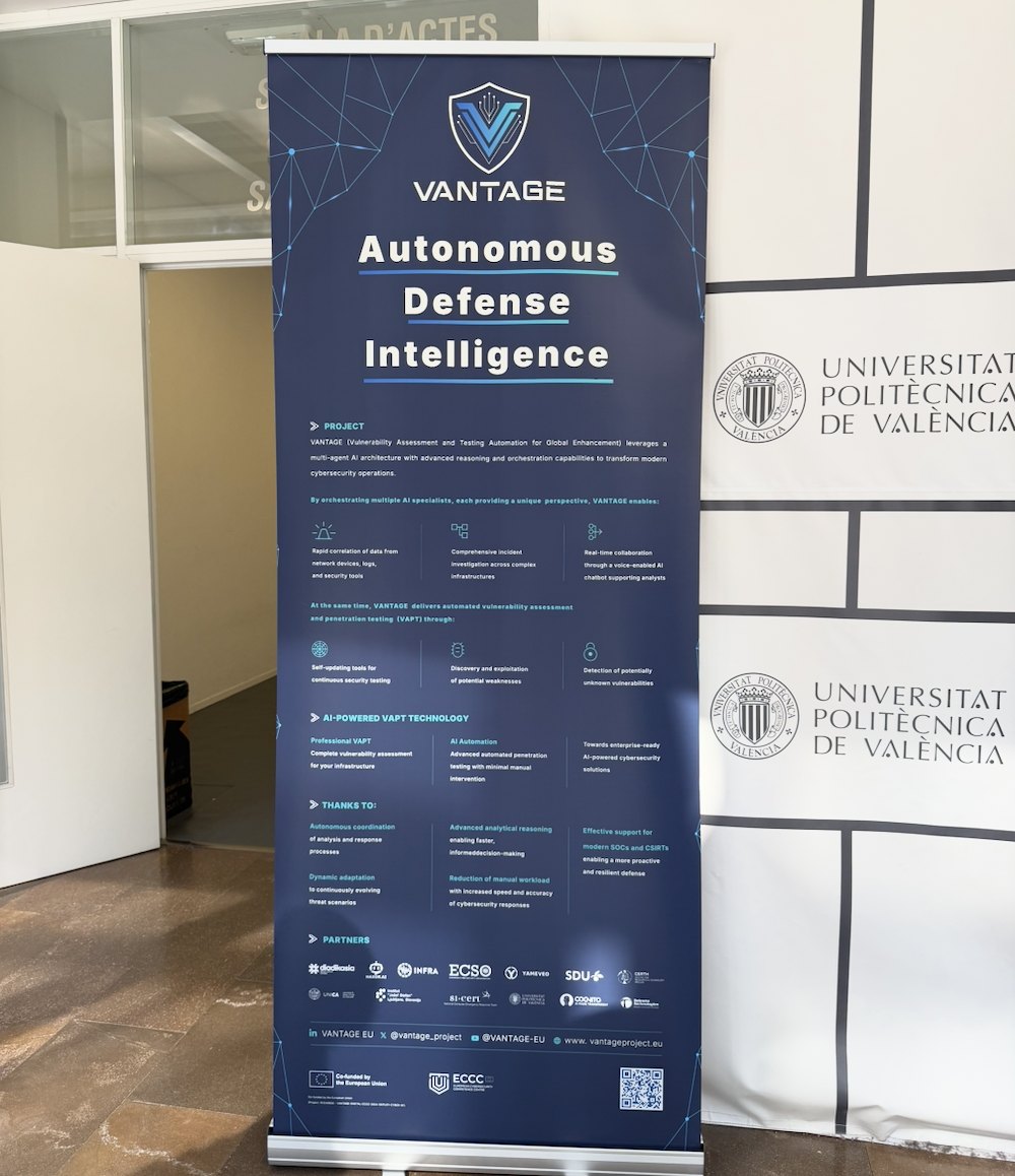 VANTAGE roll-up banner reading Autonomous Defense Intelligence, next to a Universitat Politècnica de València backdrop