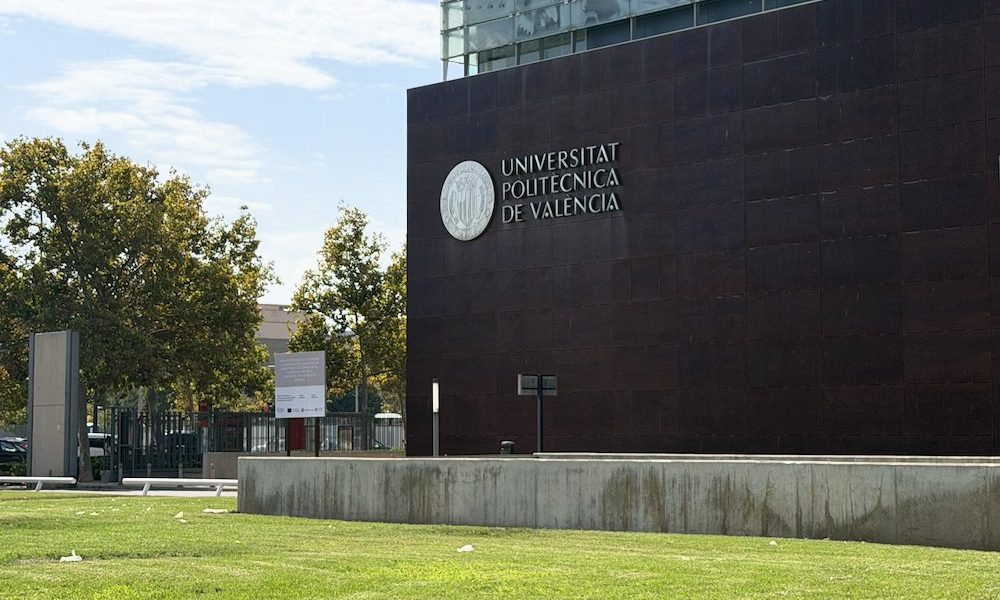 Universitat Politècnica de València building with the university name and seal on a dark façade