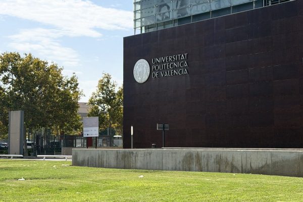 Universitat Politècnica de València building with the university name and seal on a dark façade
