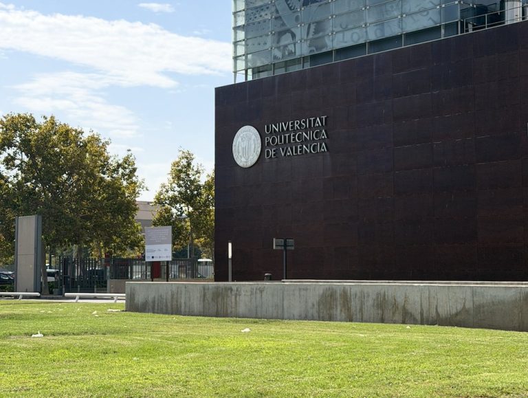 Universitat Politècnica de València building with the university name and seal on a dark façade